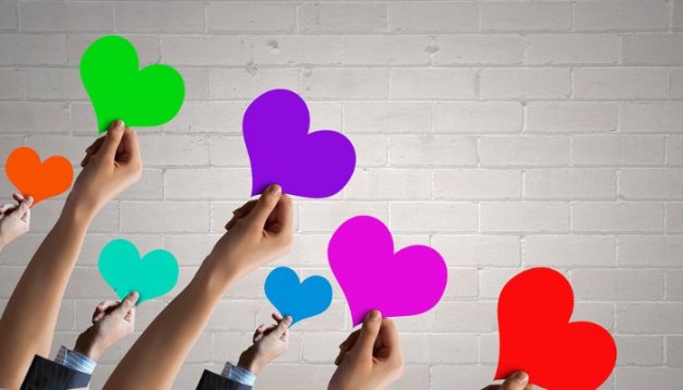 people holding hearts